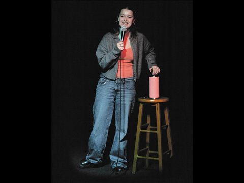 A comedian performing on the Club Voltaire stage
